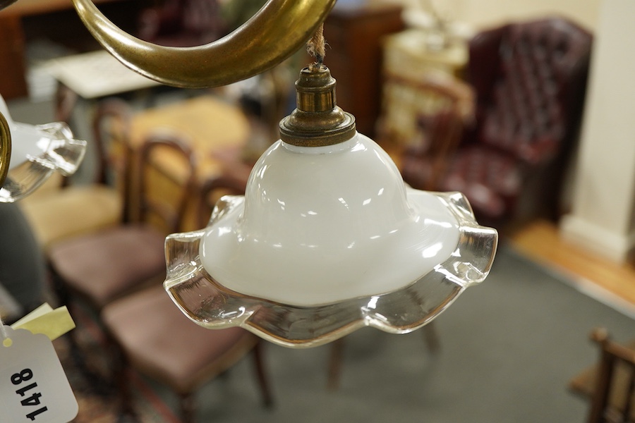 A late 19th century decorative brass, three branch hanging light, with fluted glass shades, 63cm high